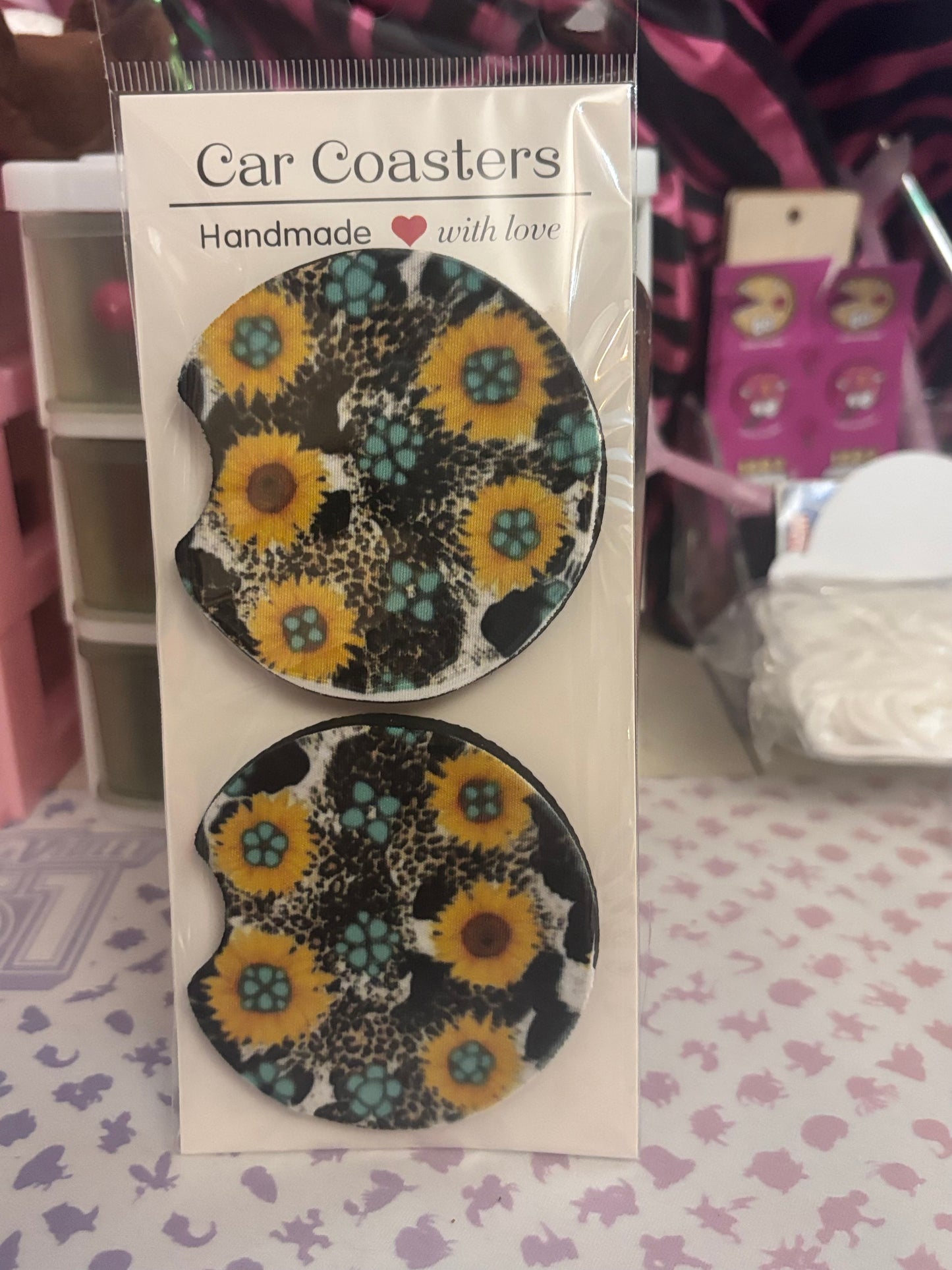 Cow print and sunflower car coaster set.