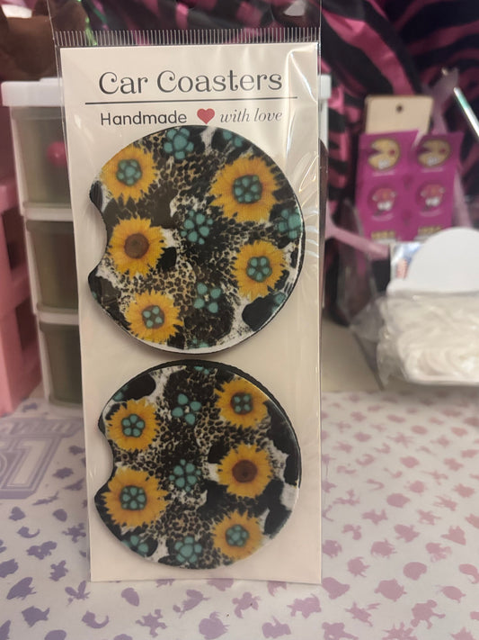 Cow print and sunflower car coaster set.
